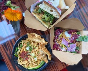 Sambal wanton mee, shaobing sandwich, sesame salad  at Lion Dance Cafe in Oakland