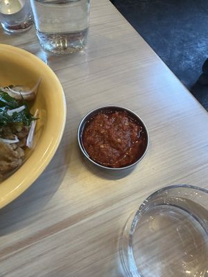 You can order the spicy sauce on the side  at Lion Dance Cafe in Oakland