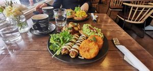 Vegan Club breakfast + smashed avocado (in background) at The Vegan Club in Carlton North