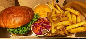 Classic burger meal with green goddess sauce. at Eden Jaxx in Copenhagen