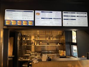 Menu board and kitchen  at Eden Jaxx in Copenhagen