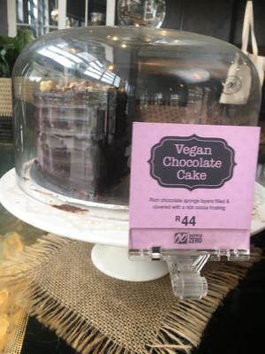 Vegan chocolate cake on display at the main bar at Doppio Zero in Umhlanga