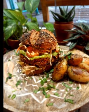 Burger vegan homemade (bread too) with quinoa steack guacamole, coleslaw, onions caramelised and potatoes at 1001 Saveurs Sauvages in Ajaccio