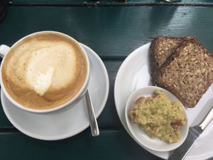 Schwarzbrot mit Guacemole und Milchkaffee mit Sojamilch at Frau Lüske Kaffeehaus in Berlin