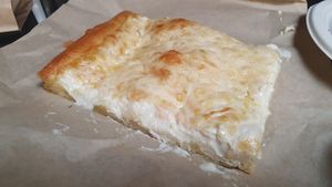 Bread with melted "cheese" at Jaa Nu' Rosticceria Vegana in Genoa