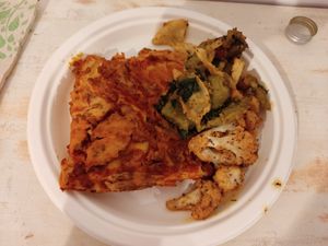 Soy ragu lasagna with cauliflower and tempeh vegetables at Jaa Nu' Rosticceria Vegana in Genoa