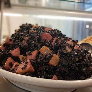 Black rice with pear and almonds at Jaa Nu' Rosticceria Vegana in Genoa