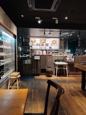 The inside of the restaurant and the menu with a lot of vegan options at Ganjin Shokudo 鑑真食堂 in Kumamoto