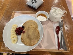 Vegan pancakes with soy milk whipped cream and fresh fruit! Iced coconut and soy milk for the win 🤩  at Ganjin Shokudo 鑑真食堂 in Kumamoto