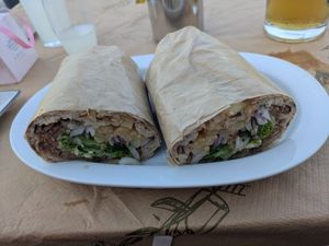 Vegan gyros wrap with hummus fries and veggies at Psitopolio Megas in Kefalonia