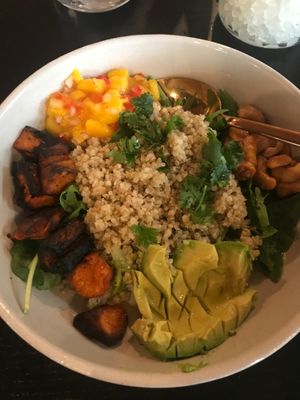 Tropical Veggie Bowl: Charred sweet potato, quinoa, mango, avocado, candied cashews. at Moniker Bar in Richland