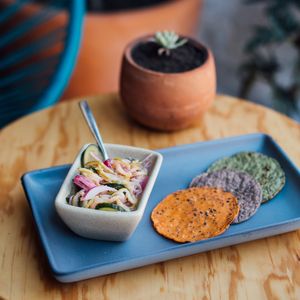Vegan aguachile - zucchini pasta with red onion and cucumber.  A flavorful Mexican appetizer, marinated in a lime juice with chile serrano and cilantro. at Clemente Café in Puebla