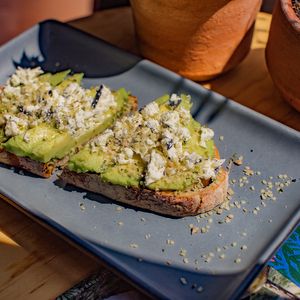 Regular Avo Toast- Delicious bread with avocado, goat cheese and hemp seeds. We also have a vegan option of this toast! at Clemente Café in Puebla
