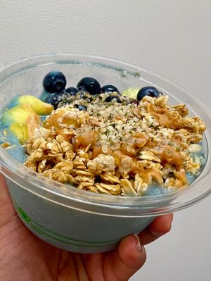 The Fiji Bowl: Blue base (blue spirulina, banana, pineapple) topped with granola, blueberries, pineapple, hemp hearts, agave and peanut butter.   at The Wild Banana in Dayton