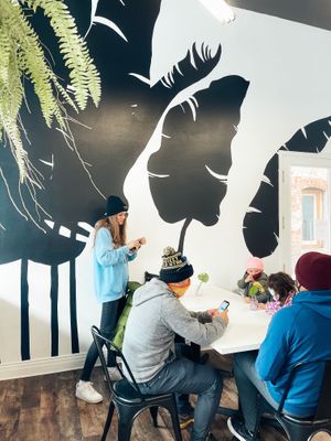 Love all of the plants and there are plenty of tables!  at Bloom in Logan