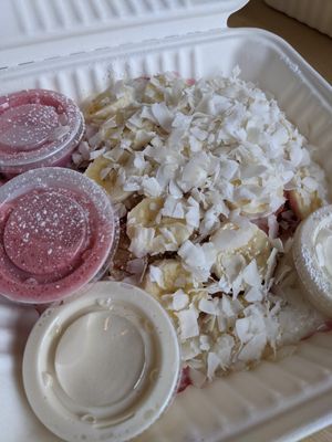 Breakfast pancakes with housemade pink coconut syrup, bananas and coconut at Bloom in Logan