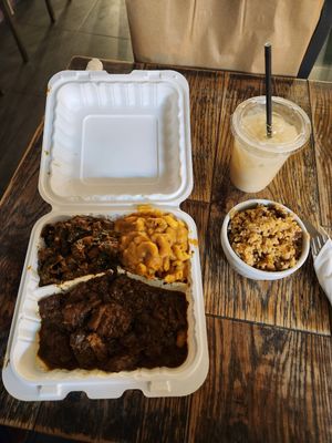 Ox tail, mac n cheese, collard greens, with side of rice and beans. Sour sop drink. at Vegan Hood in New York City