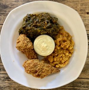Chix with mac and cheese and collard greens   at Vegan Hood in New York City