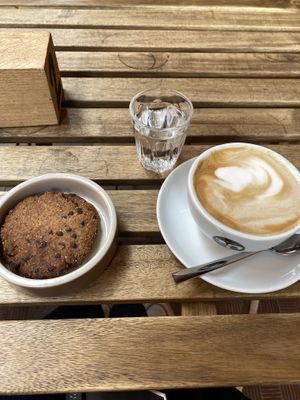 Soy milk cappuccino and vegan choc chip cookies at UNO Caffé Olistico in Bologna