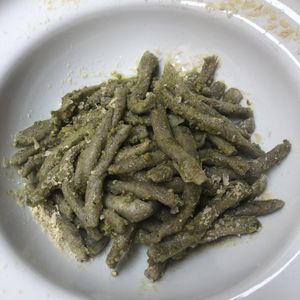 Strozzapreti with pesto   at UNO Caffé Olistico in Bologna