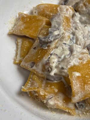 Pasta STUFFED WiTH PUMPKiN & SMOKED TOFU WiTH CREAM SAUCE & MUSHROOMS  at UNO Caffé Olistico in Bologna