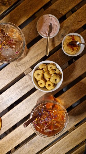 aperitif is served with hummus and vegan mayonnaise at UNO Caffé Olistico in Bologna