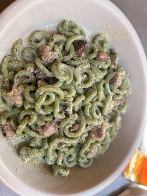 Spinach gramigna with soy cream and vegan sausagee  at UNO Caffé Olistico in Bologna