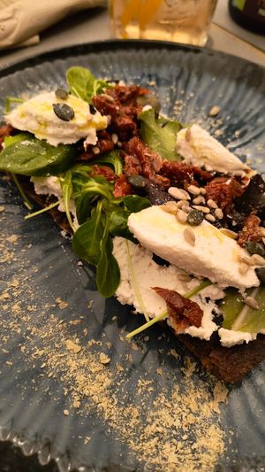 Bruschetta alla ricotta di mandorla at UNO Caffé Olistico in Bologna