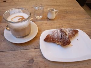 Vegan croissant with a cream filling at UNO Caffé Olistico in Bologna