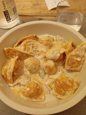 Homemade pasta stuffed with pumpkins, tofu, shiitake mushrooms and vegan cream sauce. Best pasta dish I've eaten in Bologna so far? Probably. at UNO Caffé Olistico in Bologna