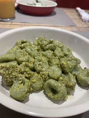 spinach gnocci with pesto  at UNO Caffé Olistico in Bologna