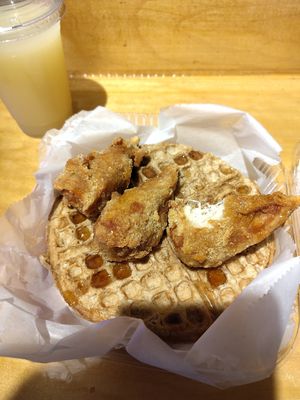Couldn't resist taking a bite before taking this picture of chicken and waffles! at Dodah's Kitchen in Baltimore