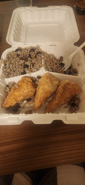 Drummies with rice and beans at Dodah's Kitchen in Baltimore