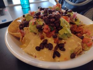 These nachos drenched in cheeze defied science & stayed crunchy to the last bite at Madame Zuzu's in Highland Park