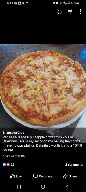 Vegan sausage and pineapple pizza! at Zois Pizza in Seymour
