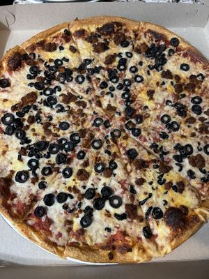 Vegan cheese, vegan chorizo, olive  at Zois Pizza in Seymour