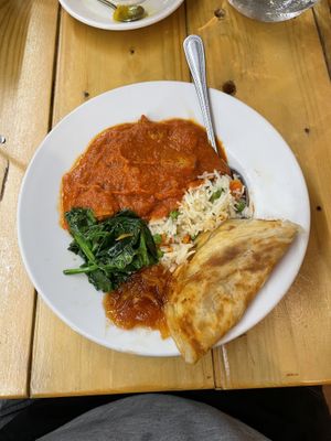 Indian curry with flatbread naan  at Karibu Vegan Bar & Kitchen in Stroud