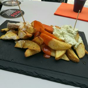 Patatas tres salsas at Cerveceria La Raposa in Oviedo