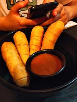 Tequeños rellenos de chocolate y para mojar at Cerveceria La Raposa in Oviedo