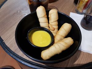 Tequeños with sweet mustard at Cerveceria La Raposa in Oviedo