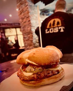 Damn bastard burger: D'arbeyu protein burger with "honey mustard", fried onion, tomato, sauerkraut, pickles, "cheese", ketchup at Cerveceria La Raposa in Oviedo