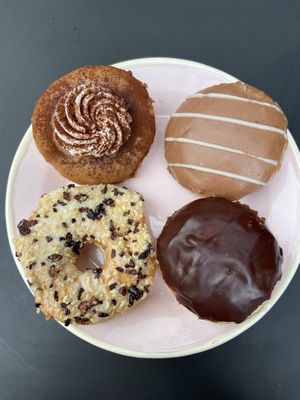 vegan donuts: tiramisu, nougat & vanilla double filled, macadamia & cocoa nibs, boston cream at Brammibal's Donuts - Alexanderplatz in Berlin