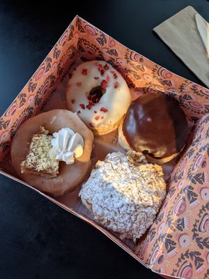 Strawberry white choc, Boston cream, apple pie and bienenstich at Brammibal's Donuts - Alexanderplatz in Berlin