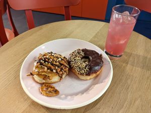 Cheesecake and Nuss Nougat Praline doughnuts, with a pink lemonade at Brammibal's Donuts - Alexanderplatz in Berlin