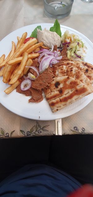 Vegan Gyros with Hummus, Pita bread and French Fries. at Mom's Kitchen in Kos