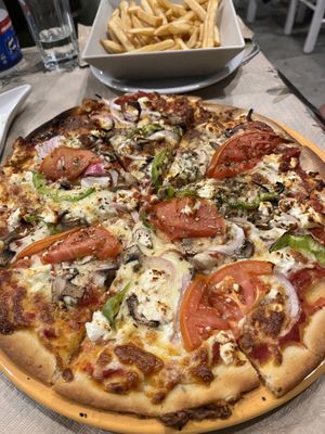 Vegetarian pizza 🍕   at Mom's Kitchen in Kos