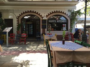 With tables in the shade, it’s a great spot to sit and watch the world (and the cats!) go by... at Mom's Kitchen in Kos