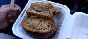Mushroom Sausage Tastie with onions and brown sause at The Vegan Street Food Company in Worthing
