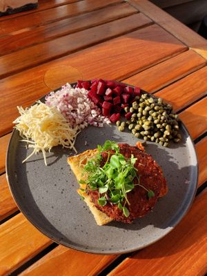 Vegan steak tartar on fried bread, with horseradish, red onion, pickled beetroot, and capers.  at Lilleheden in Hirtshals