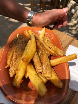 Homemade potatoes with herbs and salt at Gramboussa in Crete